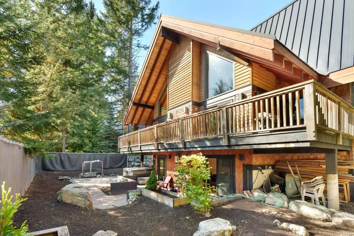 Cedar chalet among evergreen trees in Whistler